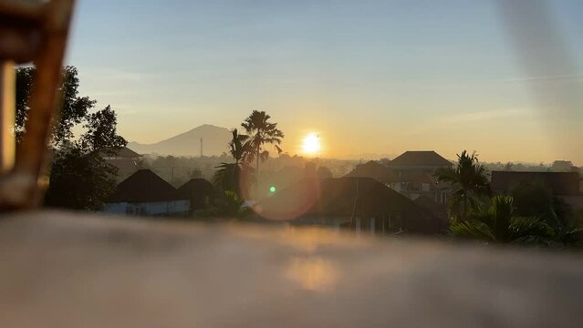 Sunrise time lapse from a rooftop volcano Agung view from Ubud Bali Indonesia