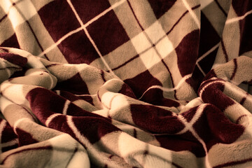 アーガイル模様の毛布の背景（茶色と白）