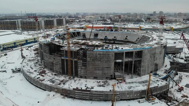 Building construction of SKA arena hockey stadium ex Saint Petersburg Sports and Concert Complex. Winter. Aerial drone view. Flying over. Drone is moving sideways to right. High quality 4k footage