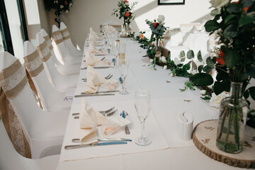 Rustic Wedding Reception Top Table seating with glasses, cutlery and dishes