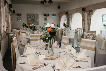 Rustic Wedding Reception Top Table seating with glasses, cutlery and dishes