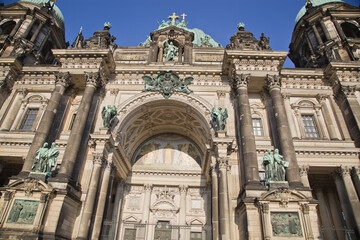 Fototapeta na wymiar Detail of the ornate Neo-Renaissance facade and dome of the Berliner Dom, Berlin Cathedral, on the eastern shores of the Museumsinsel in the Spree river, Berlin.