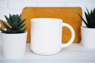 White  mug mockup for presentation sublimation designs, cup with copy space on front in lifestyle setting