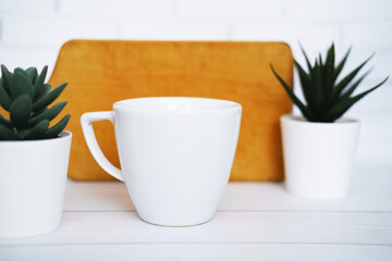 White  mug mockup for presentation sublimation designs, cup with copy space on front in lifestyle setting