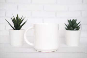 White  mug mockup for presentation sublimation designs, cup with copy space on front in lifestyle setting
