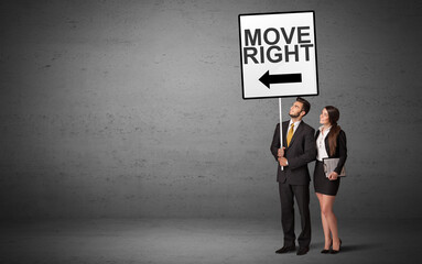 business person holding a traffic sign