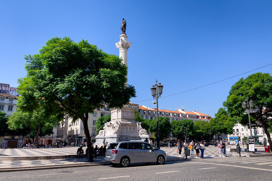  People walking nearby Rossio square in Lisbon 