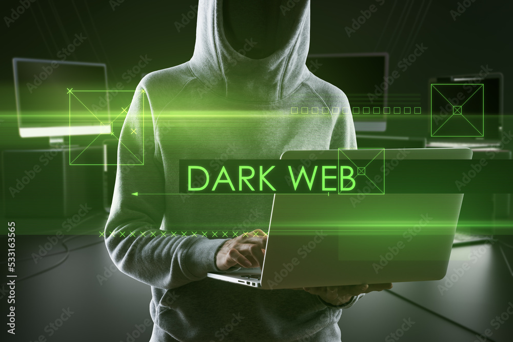 Poster Abstract dark web text over hacker holding and using laptop computer on blurry background. Hacking and attack concept. Double exposure.
