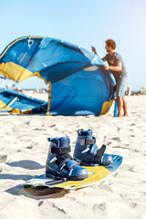 Man preparing kiteboarding kite before kitesurfing. Preparation before kiting.