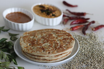 Soft Bajra Dosa. Soft and spongy pancakes made of fermented batter of pearl millet and lentils. Served with spicy coconut condiment and lentil vegetable soup