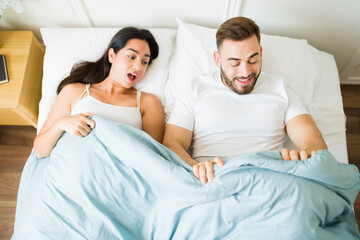 Excited couple feeling happy about having sex
