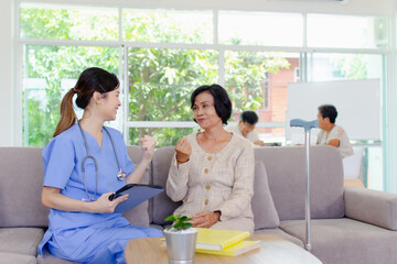 Naklejka premium Nursing Home Care concept. The staff explained to the elderly who signed a medical treatment contract, a nursing home service agreement form.