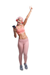 Full body length shot of smiling young sporty Asian woman fitness model in pink sportswear use mobile phone headphones listening to music. Fitness and healthy lifestyle concept.