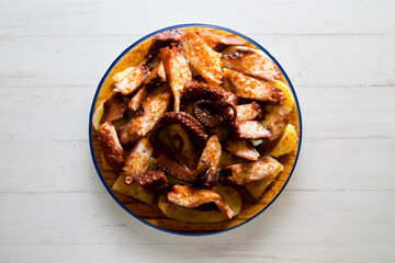 Galician-style octopus or feira-style octopus. Tapa recipe typical of the north of Spain from the region of Galicia. Octopus cooked with paprika and potato.