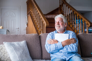 Fototapeta premium Excited elderly man celebrate health insurance deal closing looking and reading the medical results. Happy mature senior feel overjoyed make sign good bank agreement with specialist. Checking outcomes