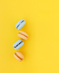 macarons on yellow background 