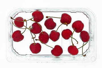 cherries in transparent plastic container