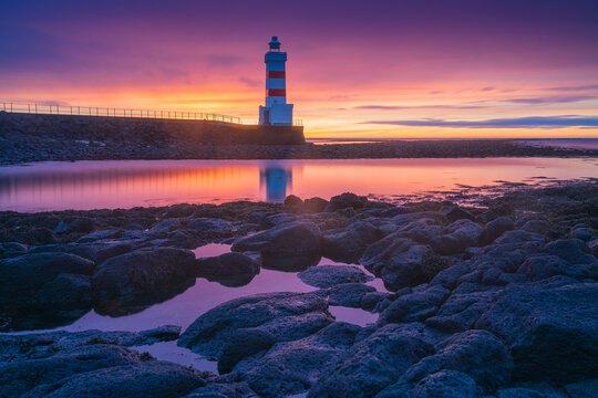 The Old Gardur Lighthouse is located in Iceland on the northern point of the Reykjanes Peninsula.