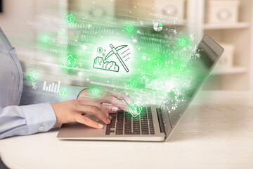 Young man watching stock market on laptop