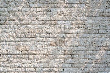 White grunge brick wall with sunlight for Texture and background