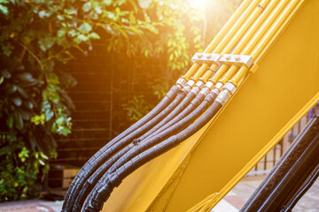 Hoses of hydraulic machine, Banner with close up view of hydraulic pipes of heavy industry machine,...