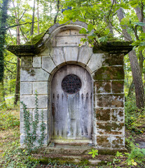 Stone building - an old tomb in the forest, northern Bohemia.