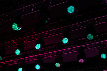 Green spotlights on stage in the concert.