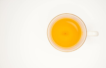 Top view of Tea in a White Glass cup Gold border on white background