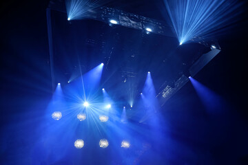 Fototapeta na wymiar Blue stage light with smoke in music festival