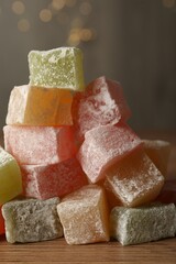 Turkish delight dessert on wooden table, closeup