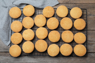 Many tasty sugar cookies on wooden table, top view