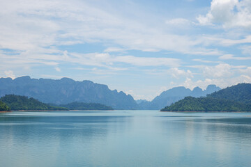 Beautiful view of mountains, lake, blue sky and natural attractions in Ratchaprapha Dam at Khao Sok National Park, Surat Thani Province, southern of Thailand.