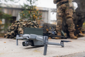 Soldier engineer launches unmanned vehicle for reconnaissance mission. Modern drone in military...