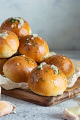 Freshly baked buns (pampushki) with garlic and dill for the first course (soup) on a baking tray. National Ukrainian dish, food. Selective focus.