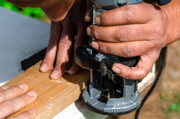 Woodworking shank router bit. Shaping copying shank router bit clamped in chuck of a working machine tool.
