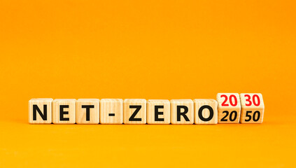 Net-zero 2030 symbol. Concept words Net-zero 2030 or Net-zero 2050 on wooden cubes. Beautiful...