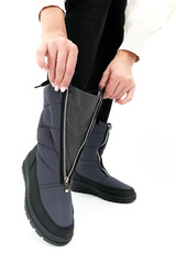 legs in gray shoes isolated on white background