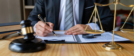 Attorneys or lawyers businessman working or reading lawbook in office workplace for consultant lawyer concept.