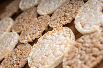 Round crisp breads on wooden background. Wheat crispbreads.