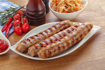 Grilled sausages with cabbage and sauce
