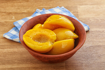 Sweet canned peaches with syrope