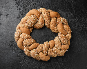 Fresh Homemade braided bread on rustic dark background