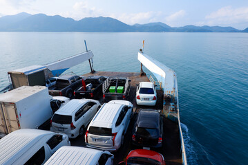 Fototapeta na wymiar Ferry Boat Taking Cars Crossing to Kho Chang island in Thailand.
