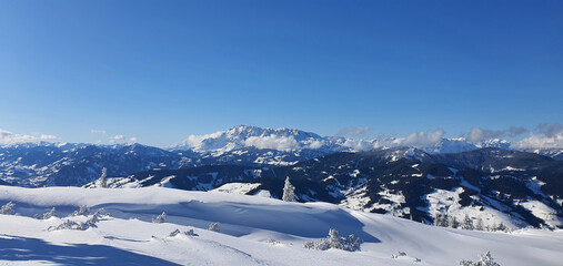 Panorama of the snow capped Alps and the view from the Griessenkareck summit near Flachau in...