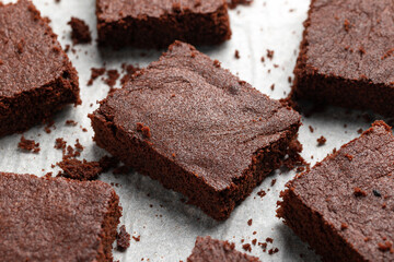 Chocolate brownies on baking paper. Sweet food