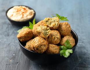 Middle Eastern vegetarian vegan chickpea and coriander falafels served with hummus