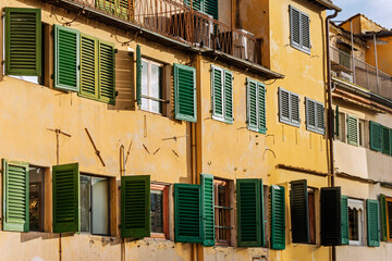 Fototapeta na wymiar Old bulding's facade in Pisa Old Town. Italy, 2019