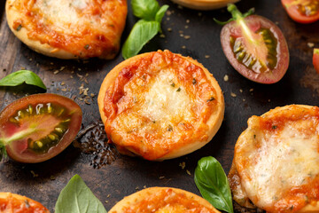 Mini pizzas with tomatoes and mozzarella cheese