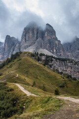 Clouds over mountain trail Gardena Pass in Dolomites