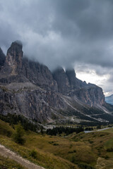 Clouds over mountain trail Gardena Pass in Dolomites